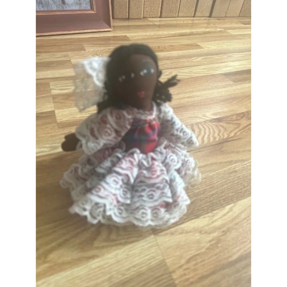 Vintage doll on basket